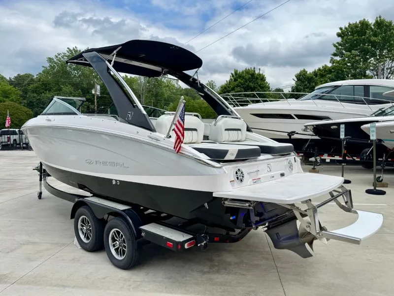 Slide: The Image of 2021 Regal LS4 boat on trailer with American flag. - 5