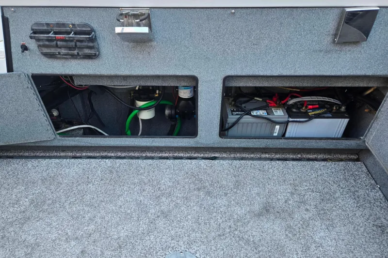 Slide: The Image of 2021 Alumaweld Intruder Outboard 20 boat interior showing battery and wiring compartments. - 13
