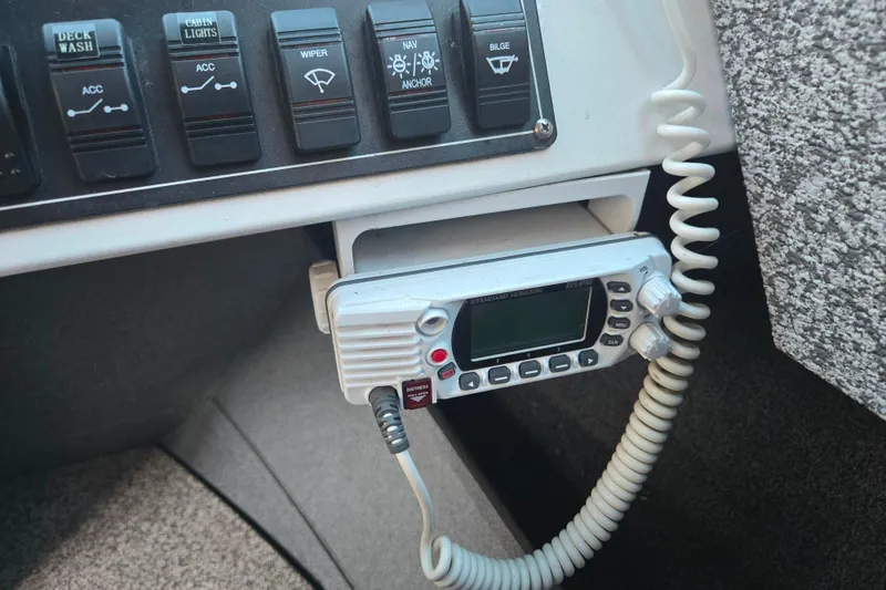 Slide: The Image of Control panel and radio in 2021 Alumaweld Intruder Outboard 20 boat cockpit. - 18
