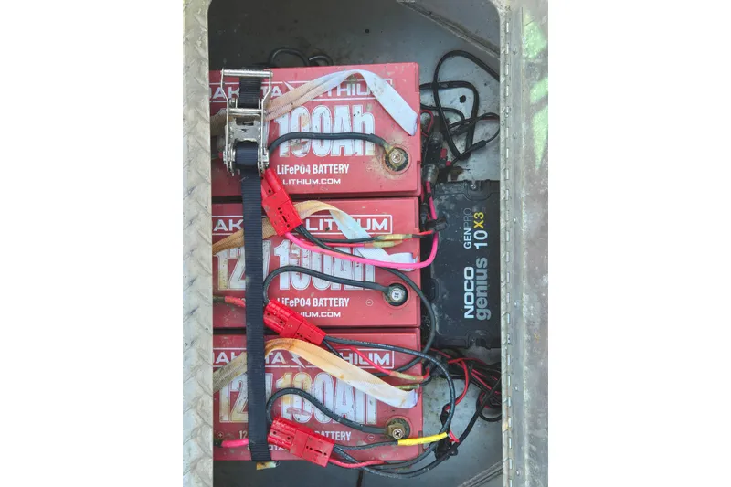 Slide: The Image of Lithium batteries and charger in 2021 Alumaweld Intruder Outboard 20 boat. - 24