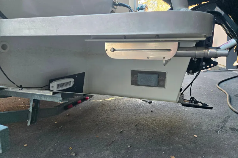 Slide: The Image of 2021 Alumaweld Intruder Outboard 20 boat underside, showcasing hull and motor components. - 6