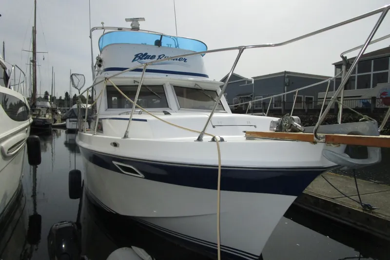 The Image of 1972 Uniflite 36 Sport Sedan boat docked in marina, front view. - 0