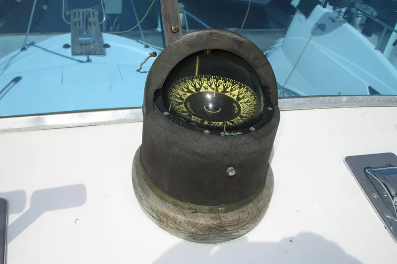 Slide: The Image of Compass on 1972 Uniflite 36 Sport Sedan boat dashboard, with visible nautical details. - 10