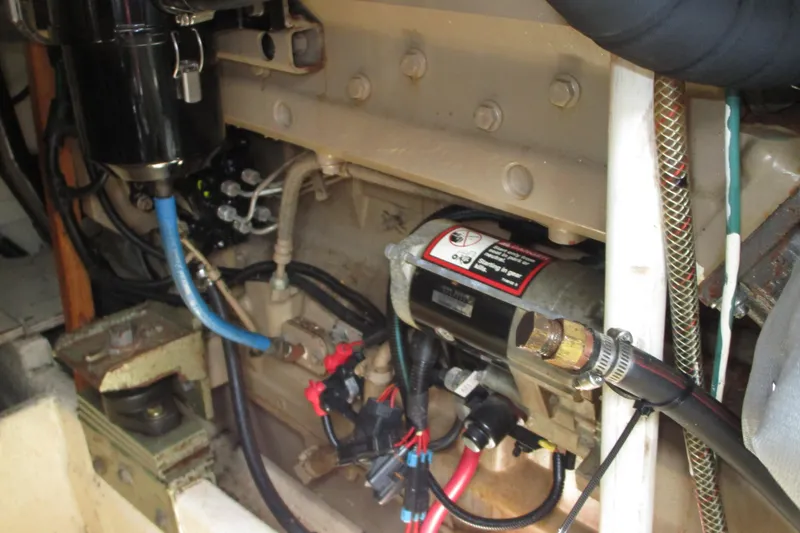Slide: The Image of Engine compartment of a 1972 Uniflite 36 Sport Sedan boat, showing mechanical components. - 13