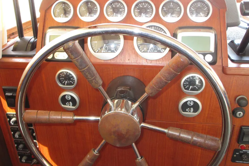 Slide: The Image of Steering wheel and dashboard of 1972 Uniflite 36 Sport Sedan boat. - 18