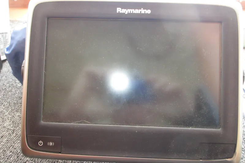 Slide: The Image of Raymarine marine display on 1972 Uniflite 36 Sport Sedan boat dashboard. - 23