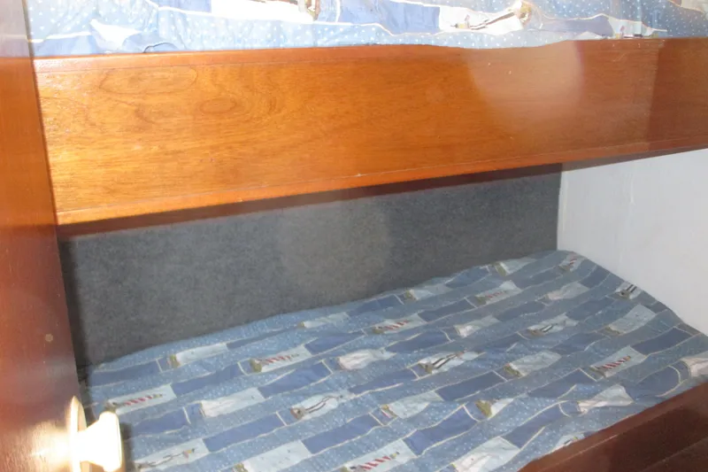 Slide: The Image of Bunk beds inside a 1972 Uniflite 36 Sport Sedan boat cabin. - 28