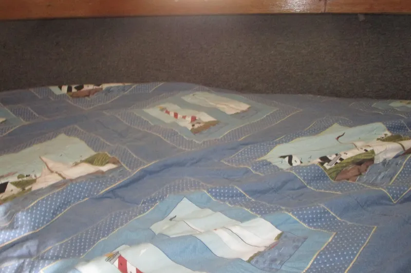 Slide: The Image of Quilted bedspread with nautical theme inside 1972 Uniflite 36 Sport Sedan boat cabin. - 34