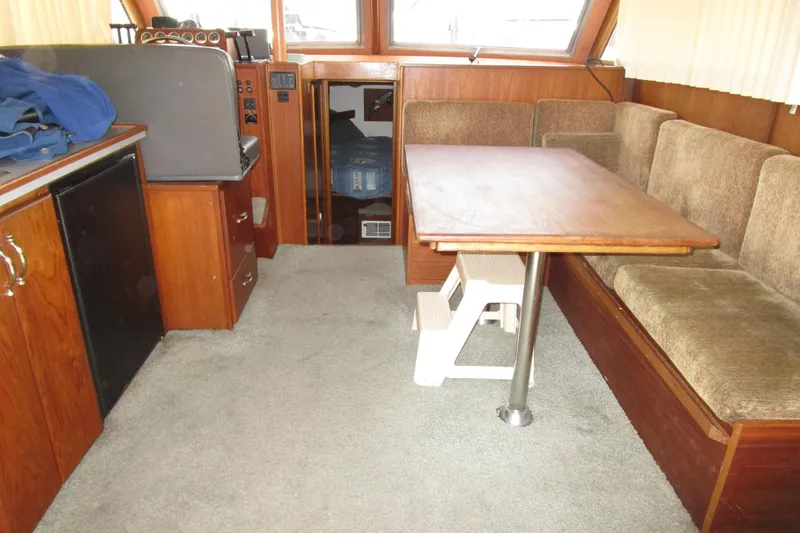 Slide: The Image of 1972 Uniflite 36 Sport Sedan interior with wood furnishings and seating area. - 35