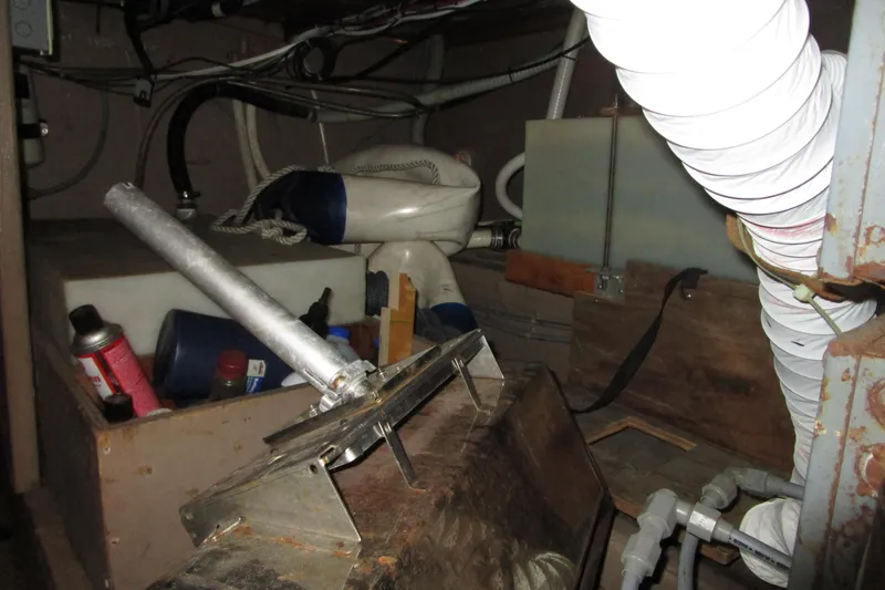 Slide: The Image of 1972 Uniflite 36 Sport Sedan engine room with tools and maintenance supplies. - 38