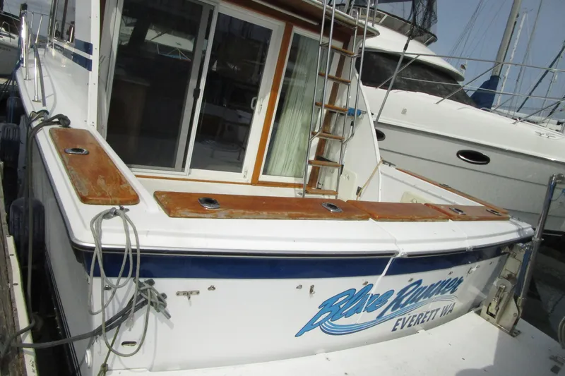 Slide: The Image of 1972 Uniflite 36 Sport Sedan docked, featuring wooden accents and ladder, Everett, WA. - 4