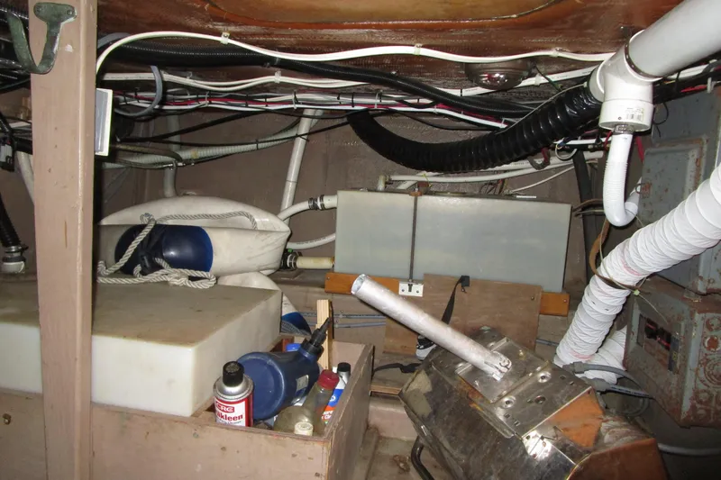 Slide: The Image of Engine room of a 1972 Uniflite 36 Sport Sedan with various equipment and wiring. - 40