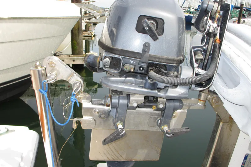 Slide: The Image of Outboard motor mounted on a 1972 Uniflite 36 Sport Sedan boat at a marina. - 6