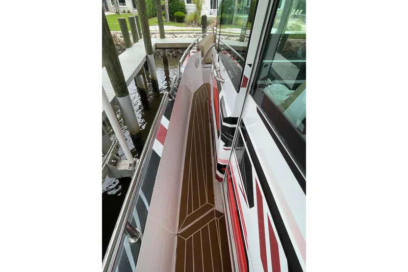 Slide: The Image of 2021 Axopar 28 Cabin boat with sleek deck design and modern graphics. - 11