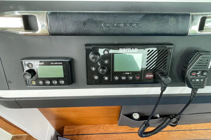 Slide: The Image of Control panel of a 2021 Axopar 28 Cabin with Simrad and Fusion devices. - 33