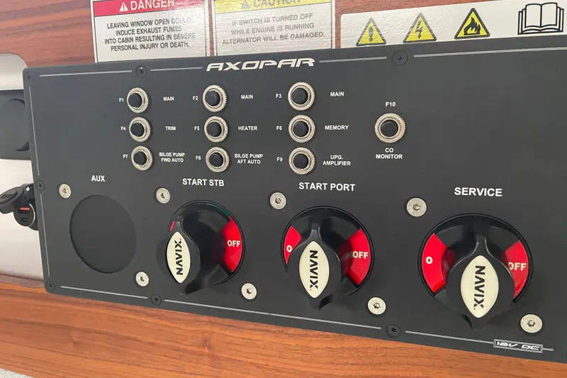 Slide: The Image of Control panel of a 2021 Axopar 28 Cabin boat with switches and knobs. - 35