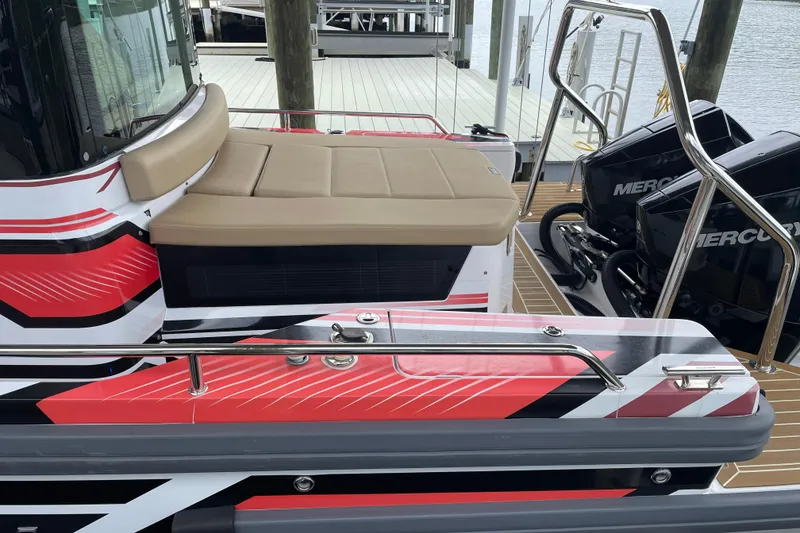 Slide: The Image of 2021 Axopar 28 Cabin boat with stylish seating and dual Mercury engines. - 37