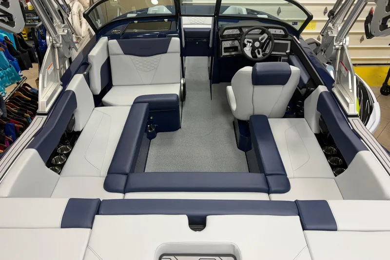 Slide: The Image of Interior of a 2026 MasterCraft NXT20 boat with modern seating and steering wheel. - 4