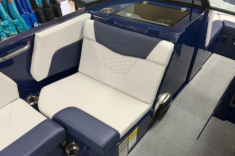 Slide: The Image of 2026 MasterCraft NXT20 boat interior with blue and white seating, showcasing modern design. - 6