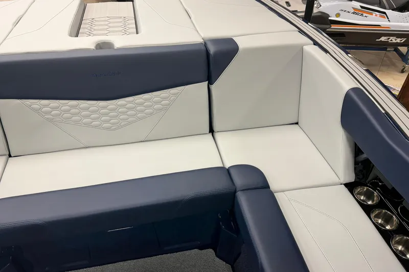 Slide: The Image of 2026 MasterCraft NXT20 boat interior with sleek, modern upholstery and stylish design. - 8