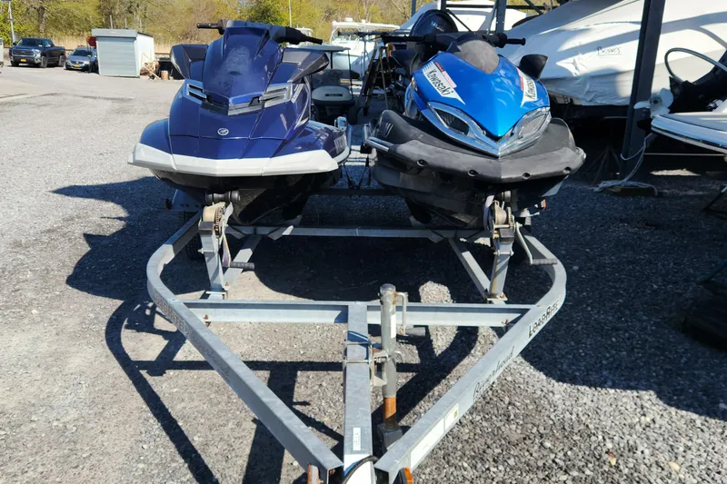 The Image of 2013 Yamaha and Kawasaki Wave Runners on trailer, FX Cruiser SHO and Ultra 300X models. - 0
