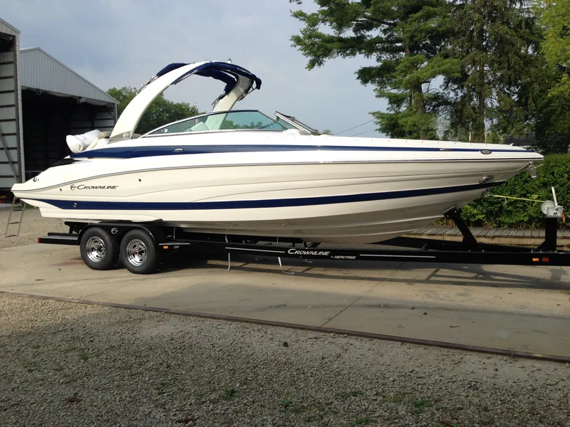 The Image of 2016 Crownline 285 SS boat on trailer outdoors. - 0