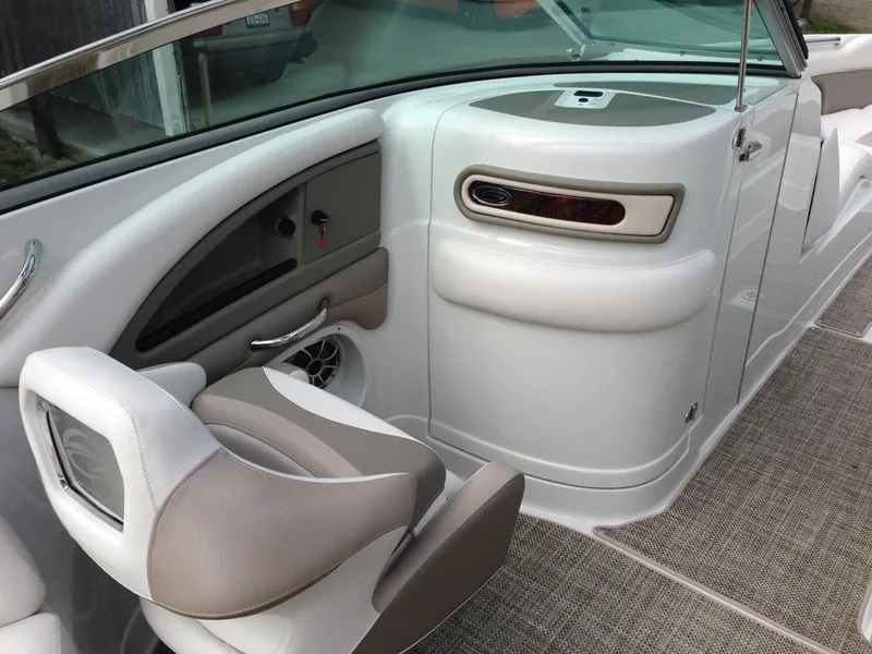 Slide: The Image of Interior of a 2016 Crownline 285 SS boat, beige and gray upholstery. - 12