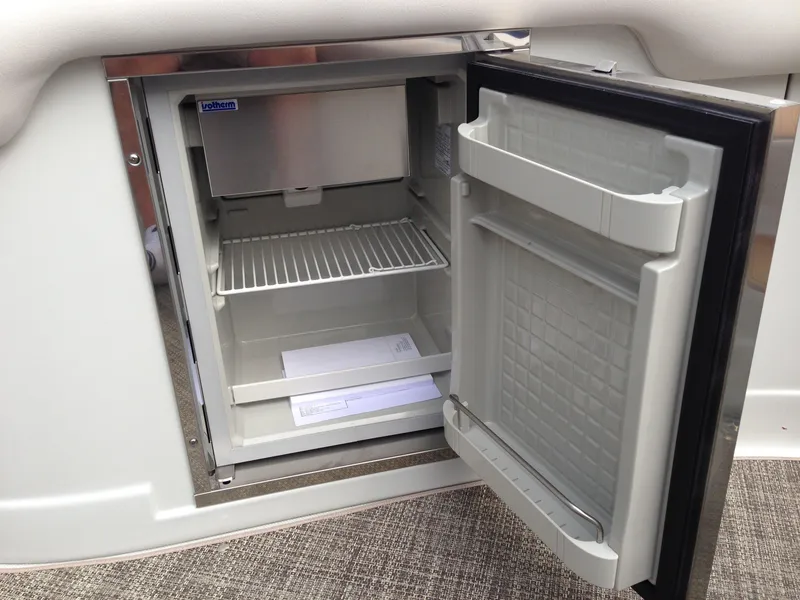 Slide: The Image of Open refrigerator on a 2016 Crownline 285 SS boat. - 14