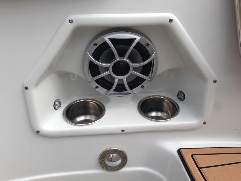 Slide: The Image of Speaker and cup holders on a 2016 Crownline 285 SS boat. - 15