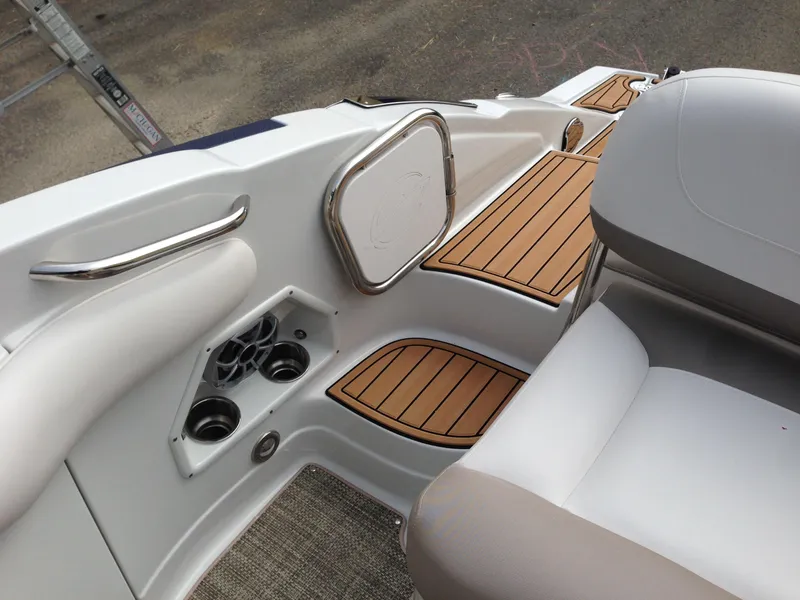 Slide: The Image of Interior of a 2016 Crownline 285 SS boat with wood accents. - 17