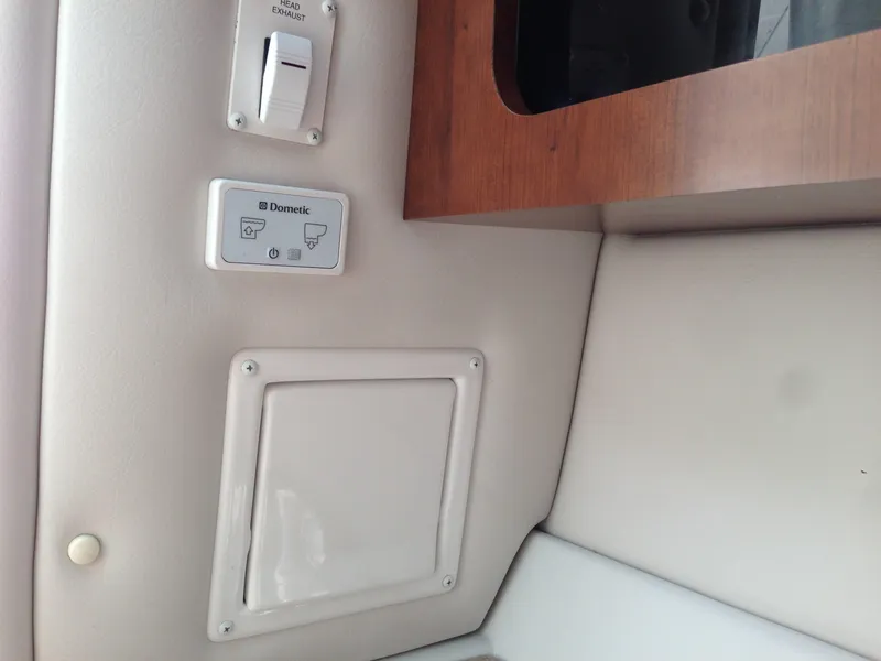 Slide: The Image of Interior of 2016 Crownline 285 SS with Dometic control panel. - 22