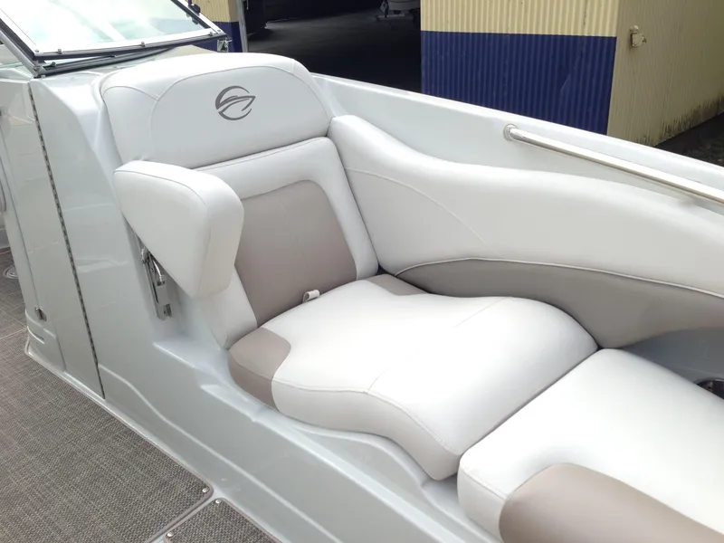 Slide: The Image of Interior of a 2016 Crownline 285 SS boat with beige and white seating. - 24