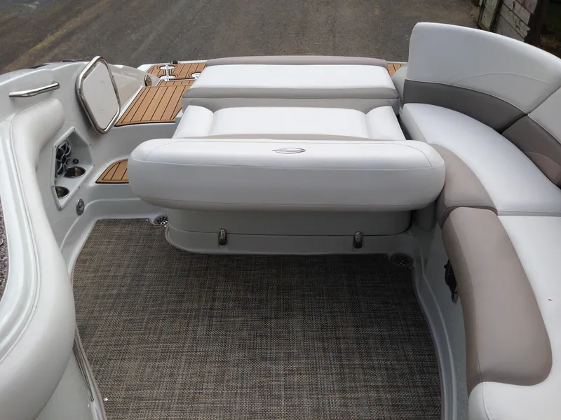 Slide: The Image of Interior of a 2016 Crownline 285 SS boat with white seating. - 28