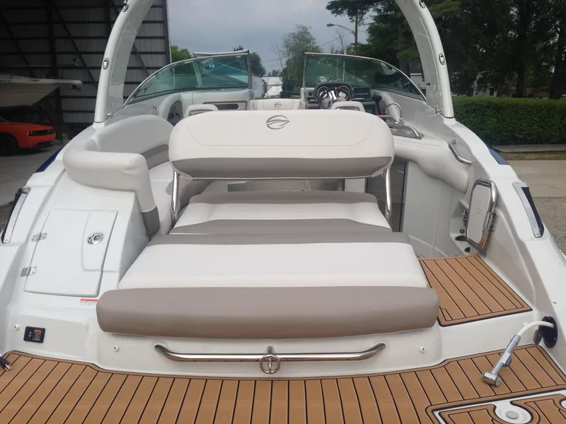 Slide: The Image of 2016 Crownline 285 SS boat with luxurious interior and wood deck. - 29