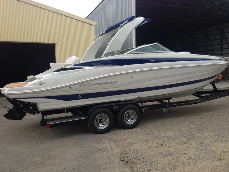Slide: The Image of 2016 Crownline 285 SS boat on trailer in warehouse. - 3