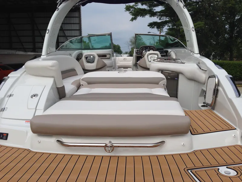 Slide: The Image of 2016 Crownline 285 SS boat with luxurious interior and wood deck. - 30