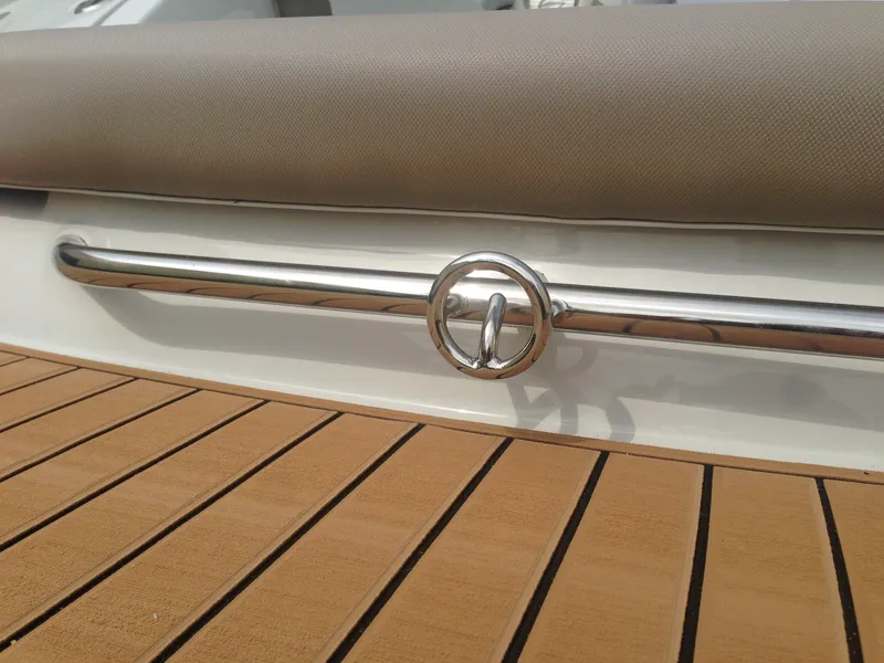 Slide: The Image of Crownline 285 SS 2016 boat, detail of railing and seating area. - 32