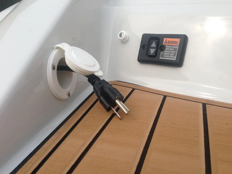 Slide: The Image of 2016 Crownline 285 SS boat with power outlet and wood deck. - 33