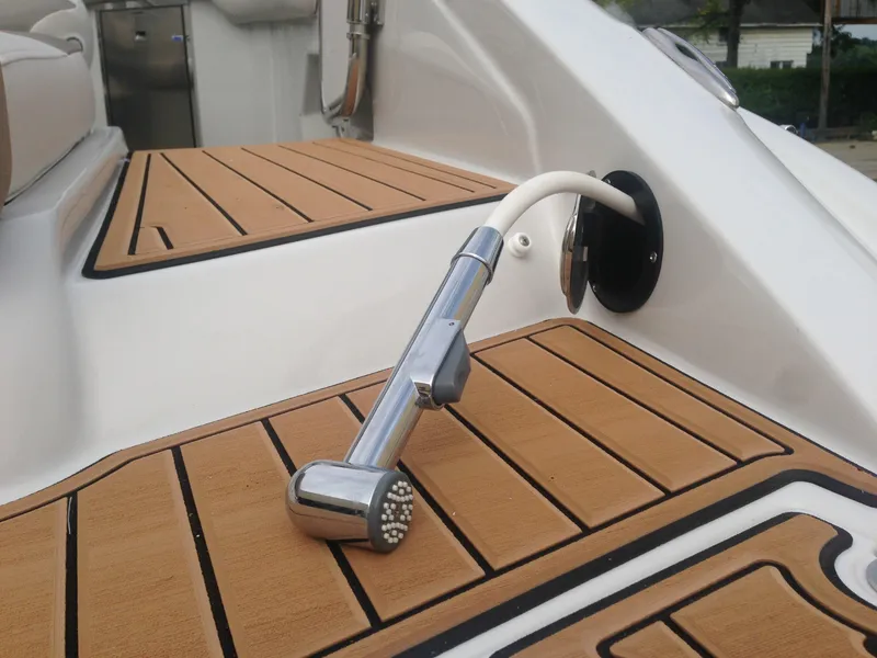 Slide: The Image of Crownline 285 SS 2016 boat shower on teak deck. - 34