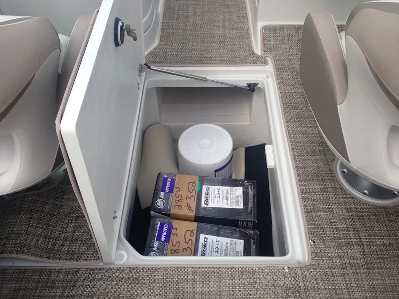 Slide: The Image of Storage compartment in 2016 Crownline 285 SS boat with accessories. - 36
