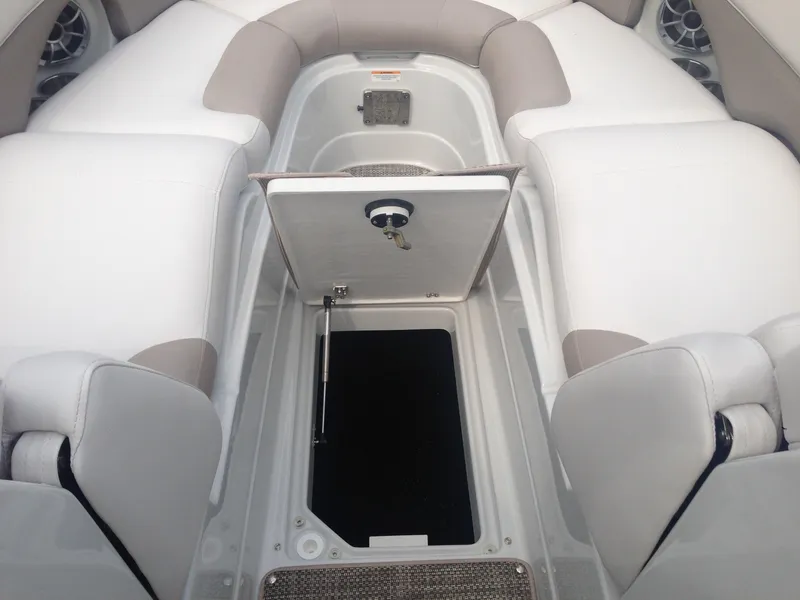 Slide: The Image of Interior of a 2016 Crownline 285 SS boat with storage compartment. - 37