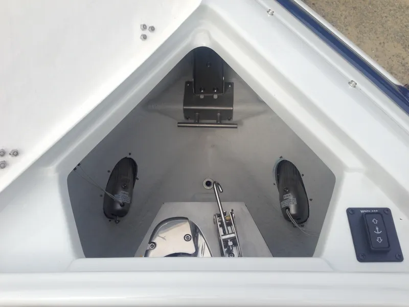 Slide: The Image of Anchor compartment of 2016 Crownline 285 SS with controls. - 38