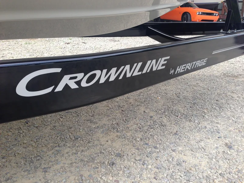 Slide: The Image of Crownline 285 SS 2016 boat trailer on gravel surface. - 42