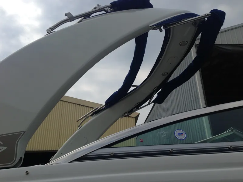Slide: The Image of 2016 Crownline 285 SS boat with sleek design and Bimini top. - 47