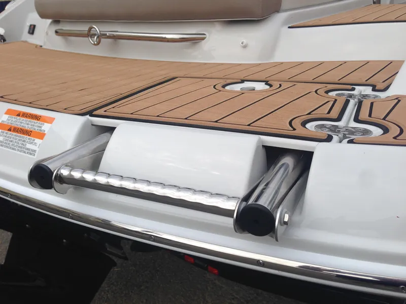 Slide: The Image of 2016 Crownline 285 SS boat with teak deck and stainless steel ladder. - 49