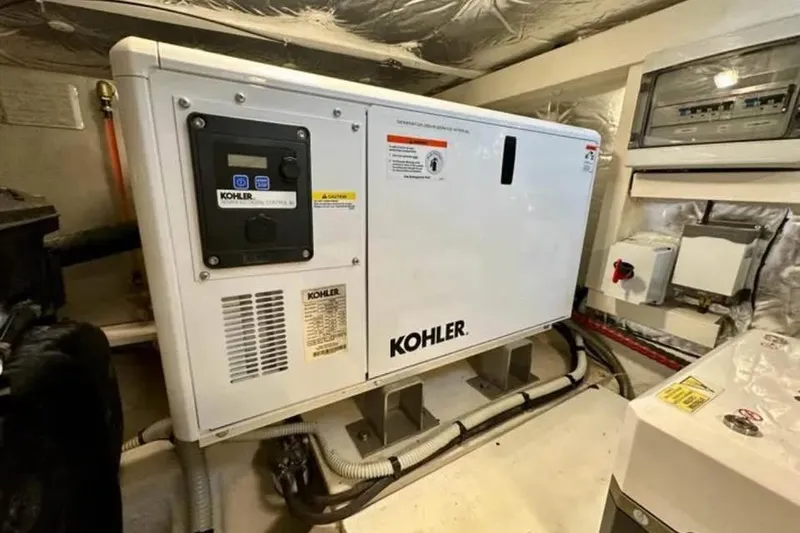 Slide: The Image of Engine room of 2021 Pardo Yachts P43 featuring a Kohler generator. - 5