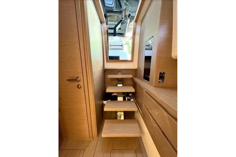 Slide: The Image of Interior of 2021 Pardo Yachts P43, featuring wooden stairs and modern design elements. - 6