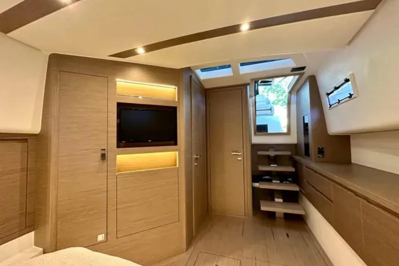 Slide: The Image of Luxurious interior of 2021 Pardo Yachts P43, featuring modern wood finishes and ambient lighting. - 8