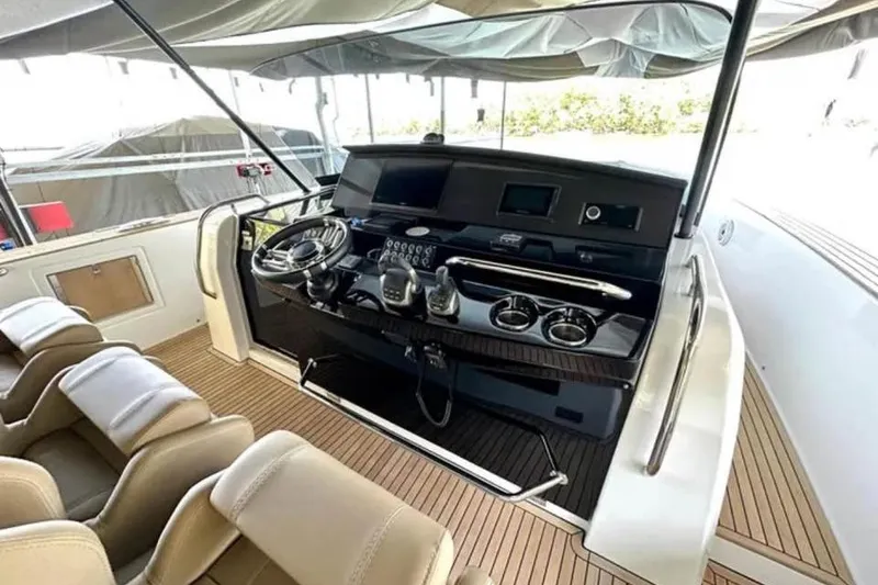 Slide: The Image of Helm of 2021 Pardo Yachts P43, featuring modern controls and luxurious seating. - 9