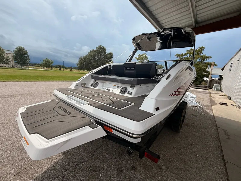 Slide: The Image of 2025 Scarab 285 LX boat on trailer, rear view. - 3